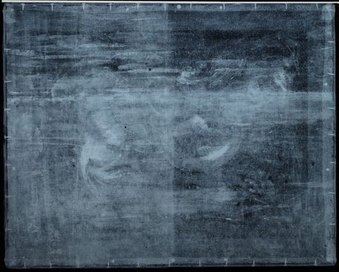 X-radiograph. A few forms are discernible in a black and white haze, including a ring near the centre.